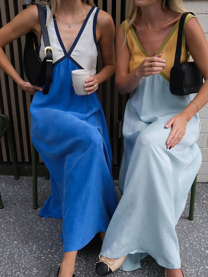 Schickes Kleid mit V-Ausschnitt und kontrastierender Farbspleißung