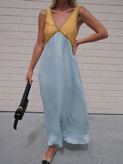 Schickes Kleid mit V-Ausschnitt und kontrastierender Farbspleißung