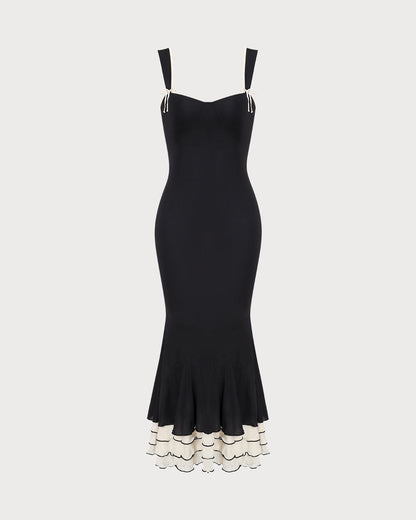 Das schwarze, figurbetonte Maxikleid mit Sweetheart-Ausschnitt