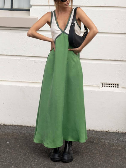 Schickes Kleid mit V-Ausschnitt und kontrastierender Farbspleißung